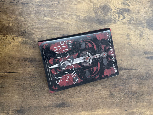 The Shadows Between Us by Tricia Levenseller (Hardcopy)